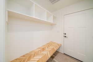 Mudroom featuring parquet flooring