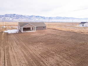 Exterior space with a mountain view, a patio area, and a rural view