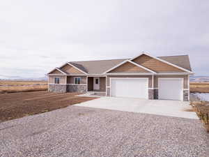 Craftsman-style house featuring a garage