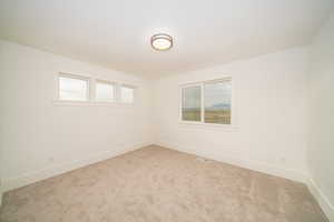 View of carpeted spare room