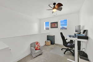 Carpeted office with ceiling fan