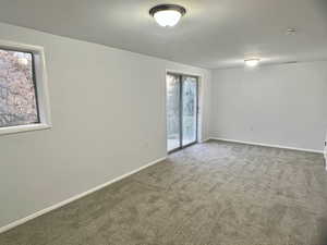 Empty room with carpet flooring