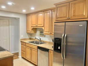 Kitchen featuring light hardwood / wood-style floors, sink, and stainless steel appliances