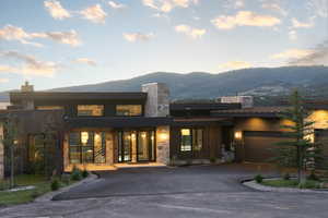 Modern home with a mountain view and a garage