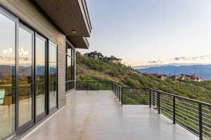 Balcony at dusk with a mountain view