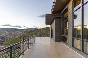 Balcony at dusk with a mountain view