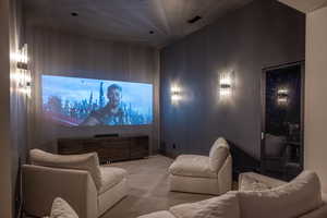 Home theater room featuring carpet flooring