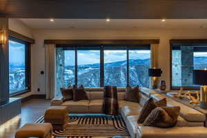 Living room with a mountain view and hardwood / wood-style floors