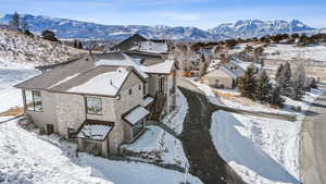 Snowy aerial view with a residential view