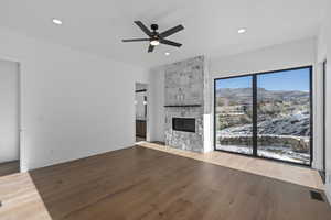 Primary Bedroom with a mountain view and  fireplace.