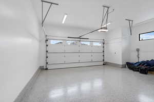 Garage featuring a garage door opener