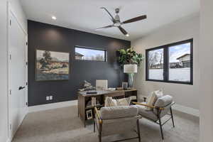 Office featuring light colored carpet and ceiling fan