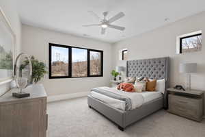 Bedroom with light colored carpet and ceiling fan