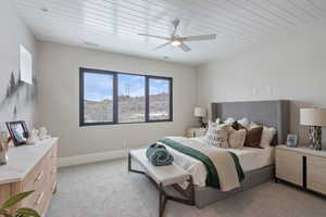 Bedroom featuring ceiling fan and light colored carpet