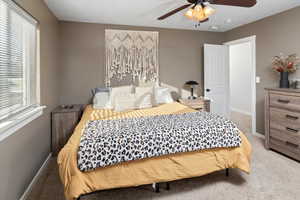 Bedroom featuring carpet flooring and ceiling fan