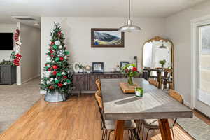 Dining area featuring wood-type flooring