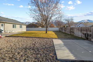 View of yard with a mountain view and a patio