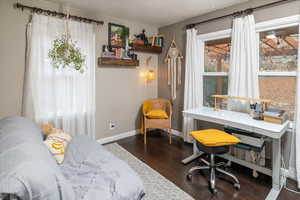 Office space featuring dark hardwood / wood-style flooring