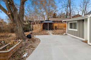 Exterior space featuring a gazebo and a patio area