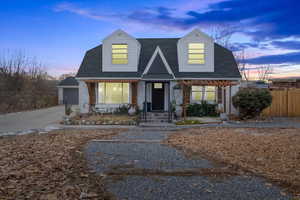 Cape cod home with a garage