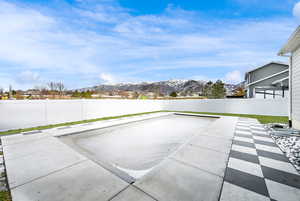 View of pool with a mountain view