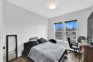 Bedroom with wood-type flooring