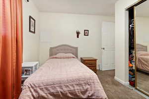 Bedroom with carpet floors and a closet