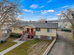 View of front of property featuring a front lawn