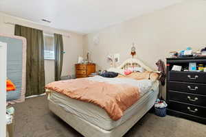 View of carpeted bedroom