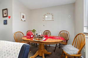 View of carpeted dining area