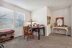 View of carpeted home office