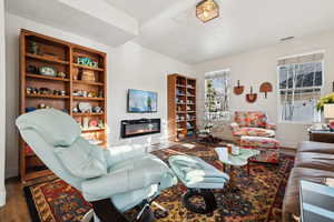 Living room featuring dark hardwood / wood-style flooring