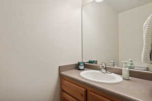 Bathroom featuring vanity and toilet