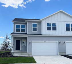 View of front of property featuring a garage ( NOT EXACT HOME COLORS MAY VARY )