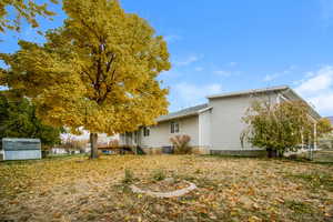 View of side of property with a storage unit and central AC unit