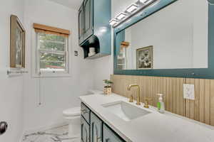 Bathroom featuring vanity and toilet