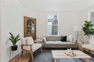 Living room with hardwood / wood-style flooring