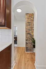 Hallway featuring light hardwood / wood-style floors