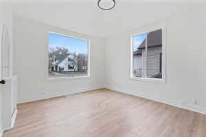 Spare room with light hardwood / wood-style flooring