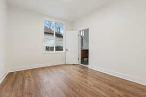 Primary Bedroom with light hardwood / wood-style floors