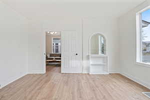 Empty room featuring light wood-type flooring