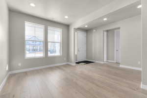 Entryway featuring light hardwood / wood-style floors and a textured ceiling