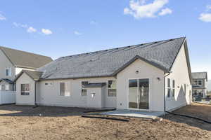 Rear view of property featuring a patio