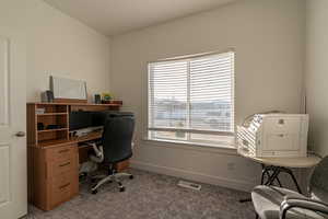 View of carpeted home office