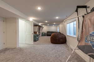 Interior space featuring carpet flooring and a textured ceiling