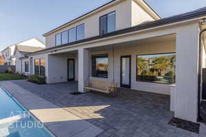 Rear view of property with a patio area