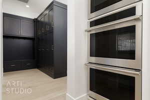 Interior space featuring light hardwood / wood-style flooring and stainless steel double oven