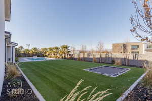 View of yard featuring a fenced in pool