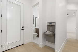 Bathroom with wood-type flooring and toilet