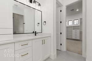 Bathroom with vanity, tile patterned floors, and an enclosed shower